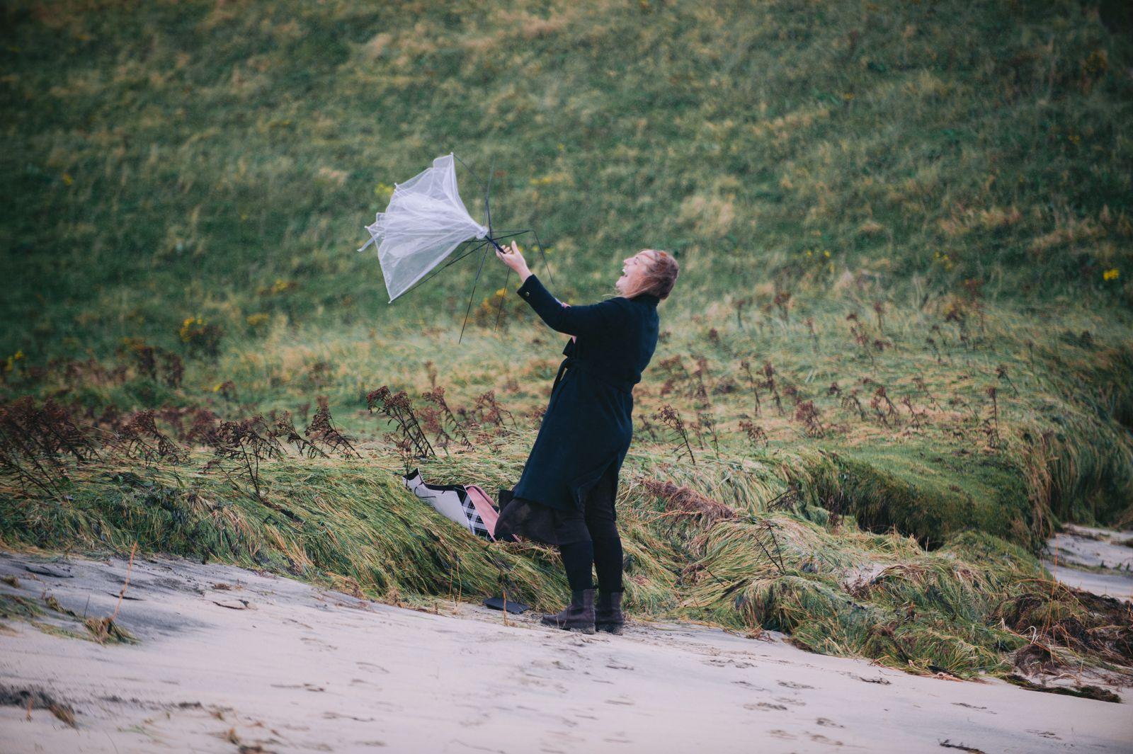 An umbrella blown inside out by the wind on the dunes above Seilebost beach