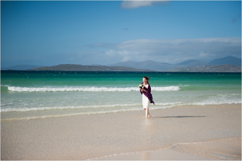 Walking along the waves at Luskentyre, Isle of Harris beach wedding, 