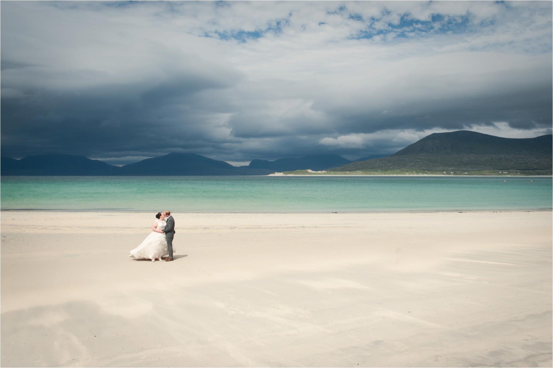 Lauren and Michael dance together on Horgabost Beach on the Isle of Harris, after their ceremony at Rodel Church. The sun came out just long enough for their wedding portraits. 