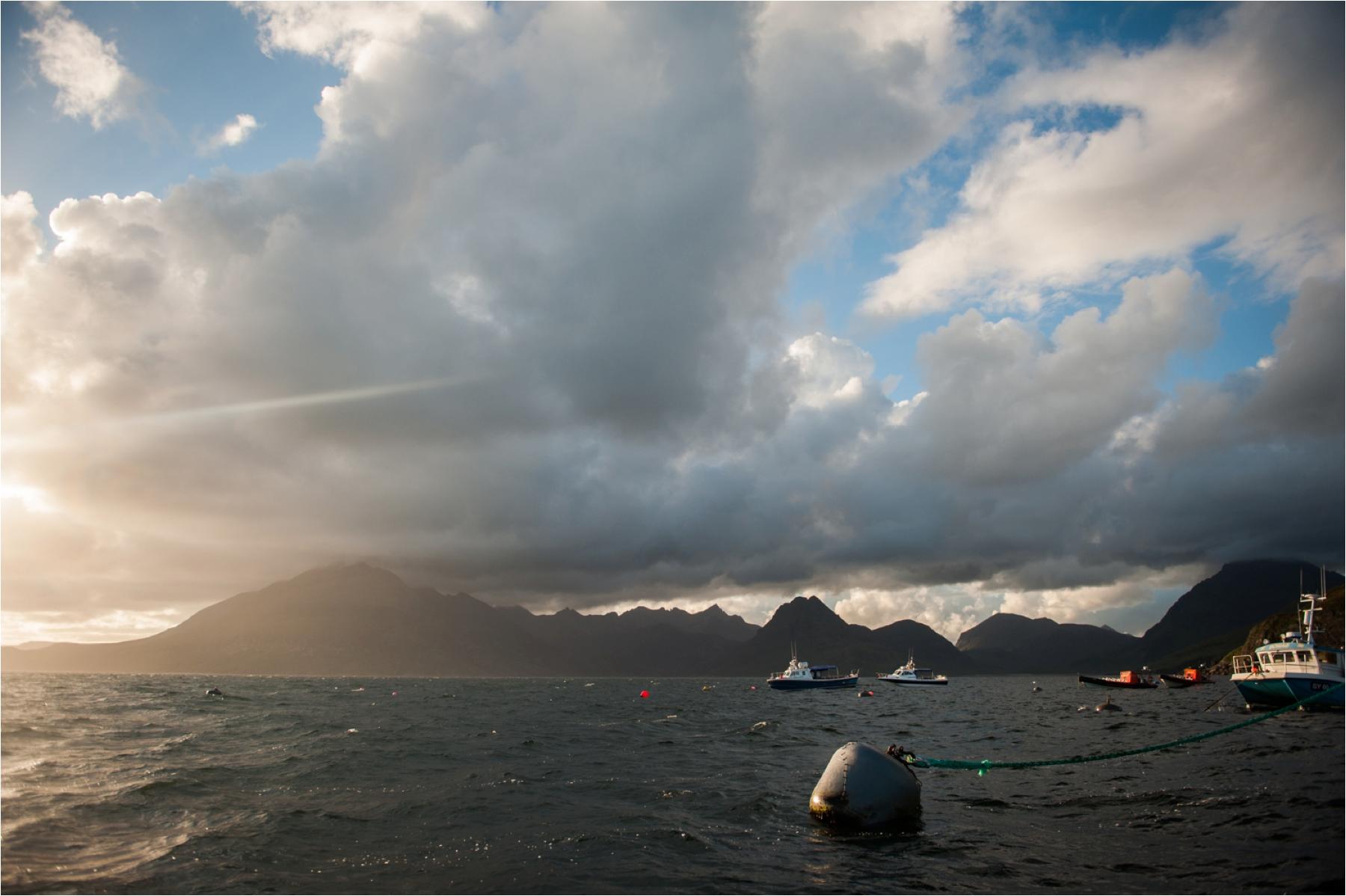 Dramatic wedding photo from misty isle boat trip 