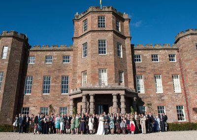 Fasque Castle exterior with wedding party