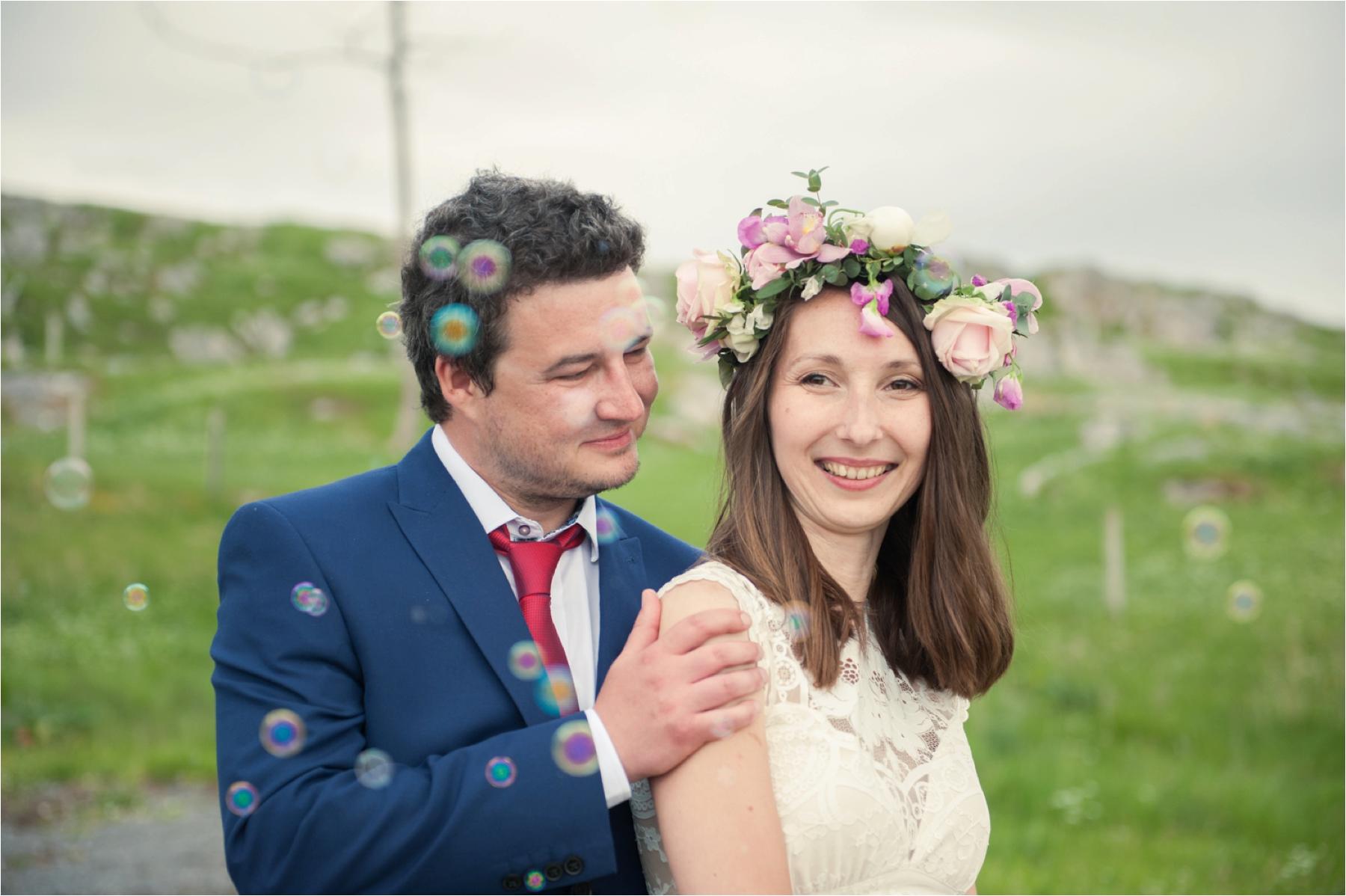 Bride Ilona and groom Emil are surrounded by bubbles after their Luskentyre Beach elopement.