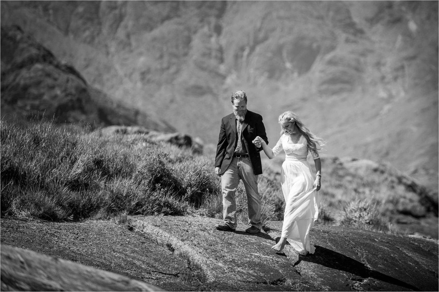 A black and white couple portrait on Loch Coruisk in the Scottish Highlands. 