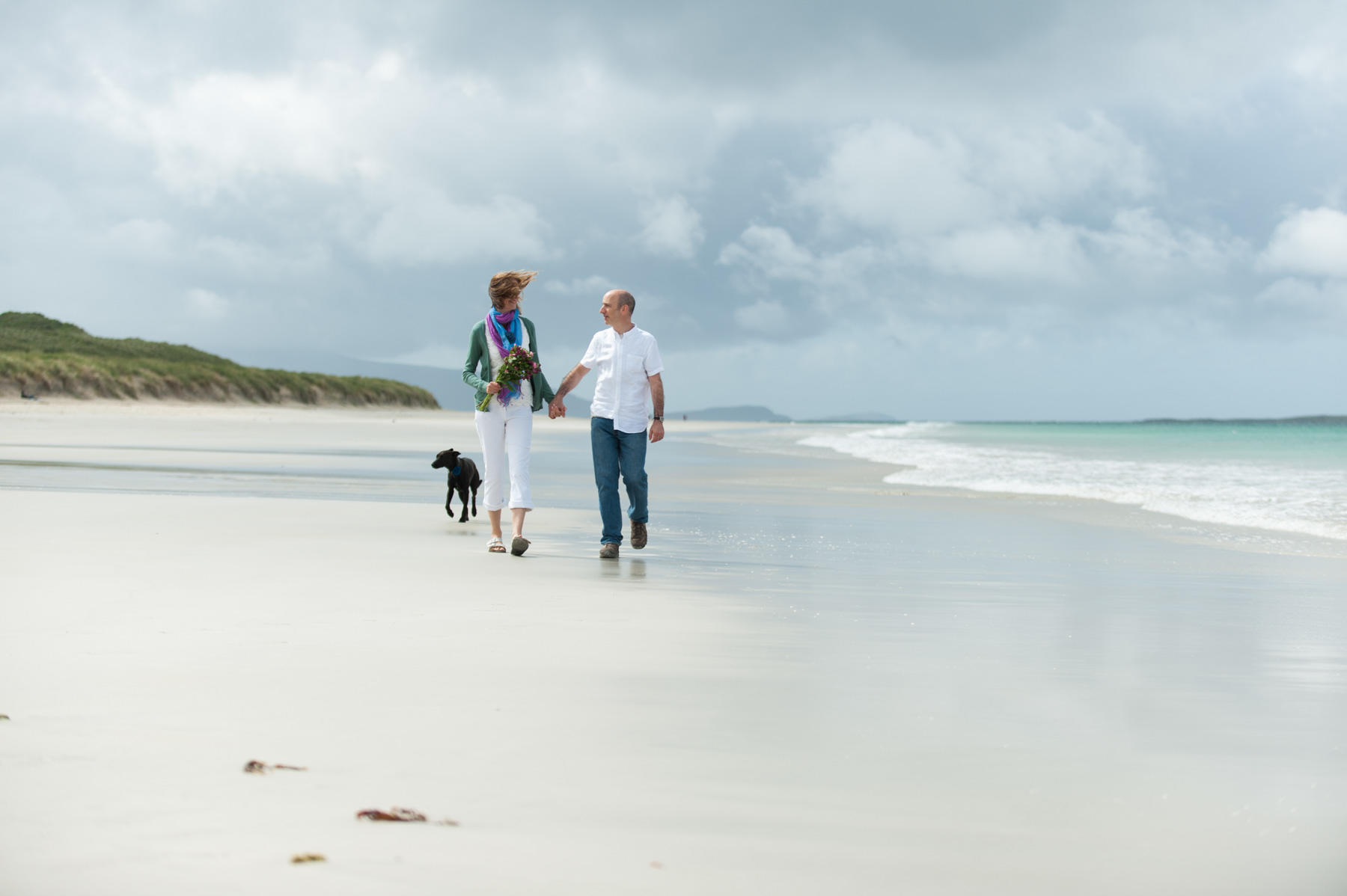 romantic walk during Luskentyre Beach wedding isle of Harris