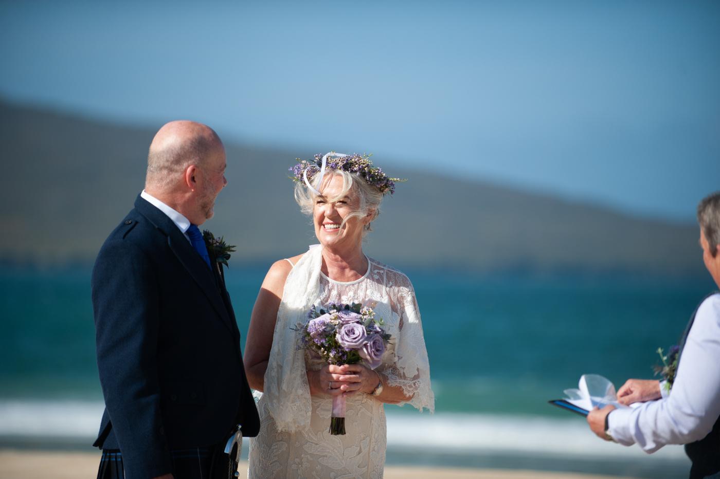 Wedding ceremony on Luskentyre Beach with piper and celebrant