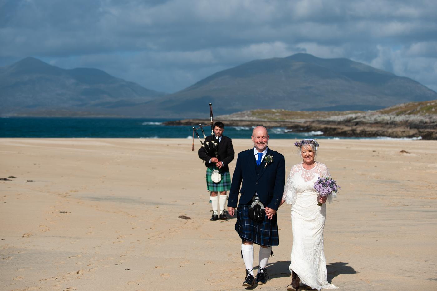 Piper leading Marge and David along the beach