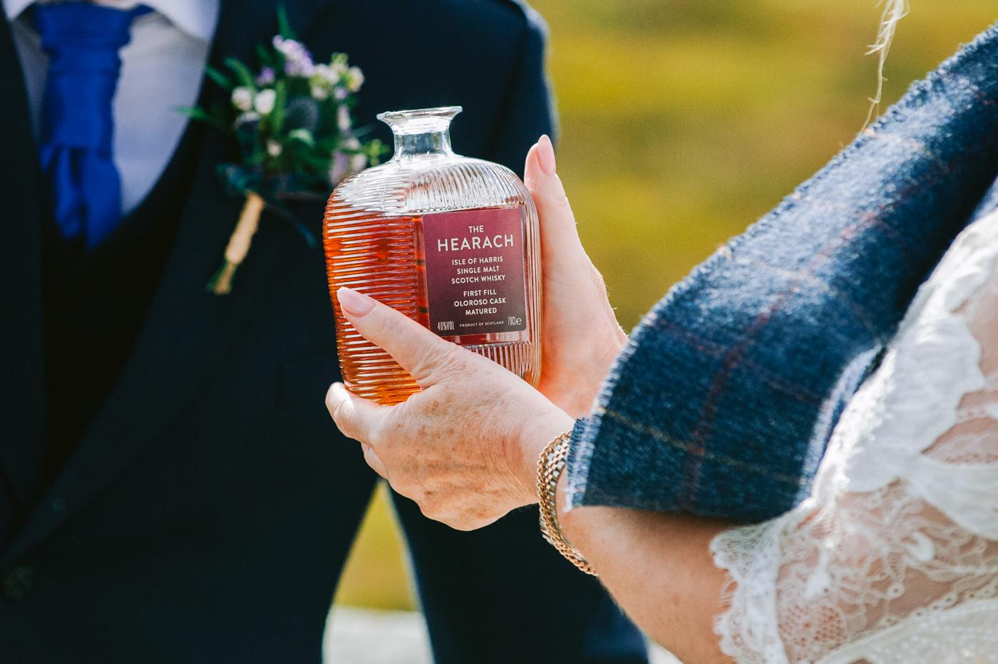 Drinking heather whisky from the quaich at the wedding