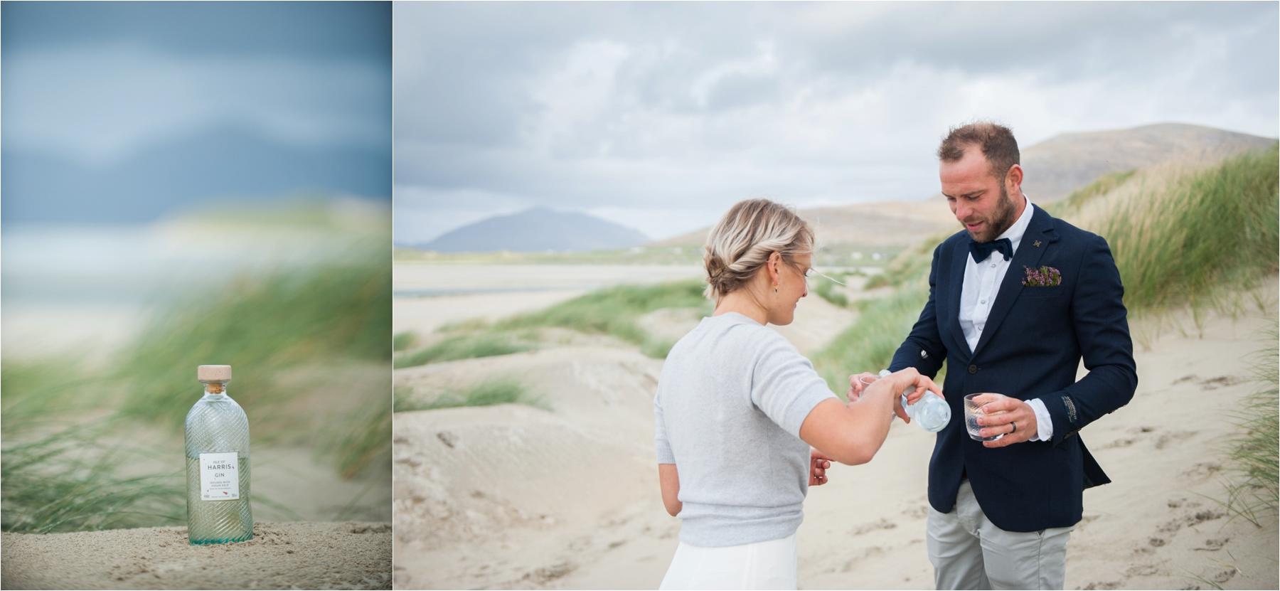 A bride and groom toast their Isle of Harris marriage with Harris Gin on celebrations with harris gin on Seilebost Beach .