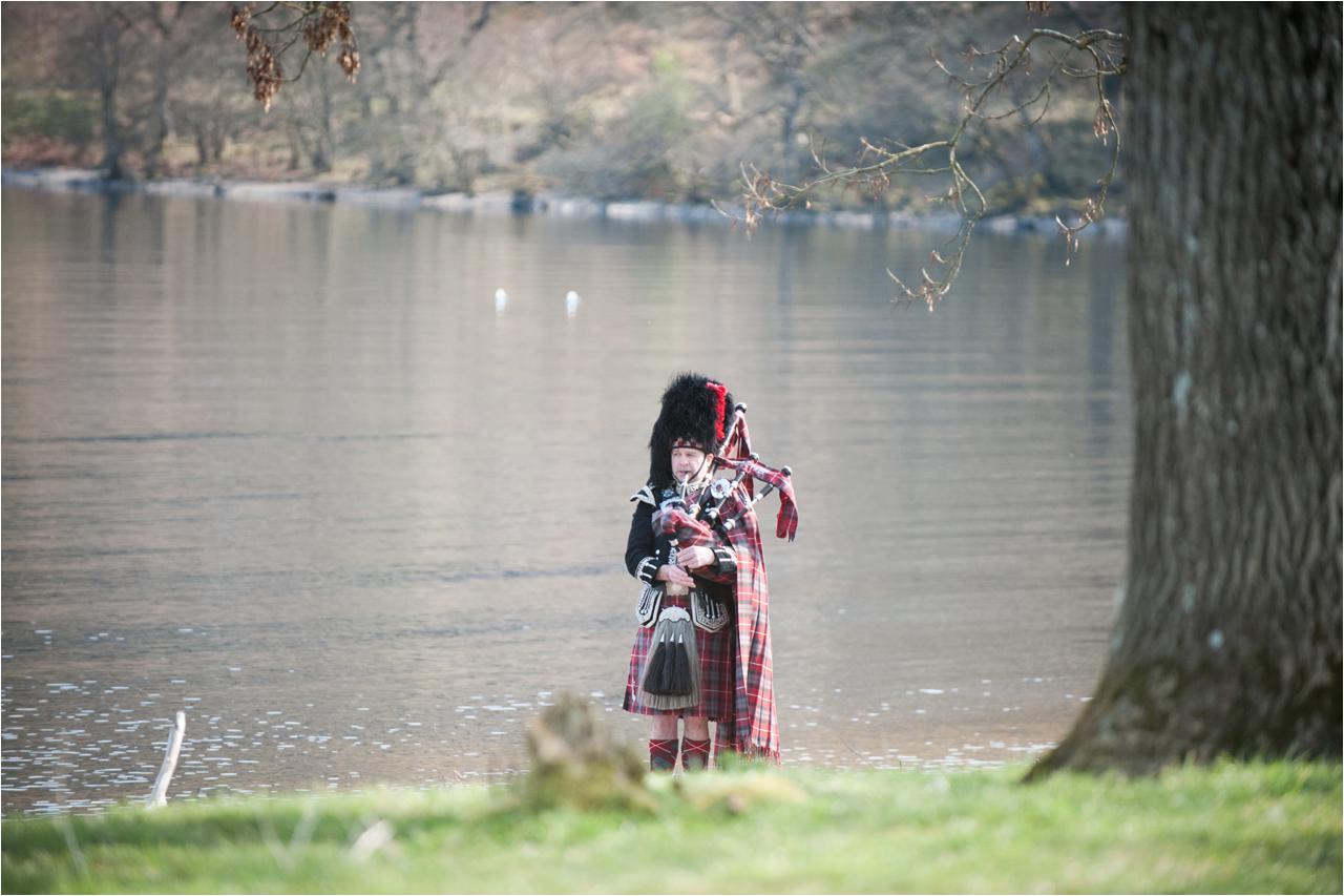 scottish piper on shores of Loch Ness during a wedding 