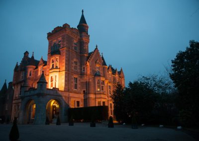 Ardroe House illuminated at dusk