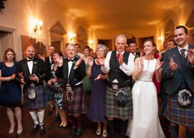 Wedding party celebrating at Fasque Castle
